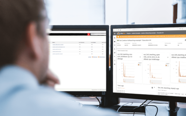 A developer looking at dual monitors showing the ElasTest dashboard with test job results and resource-usage graphs.