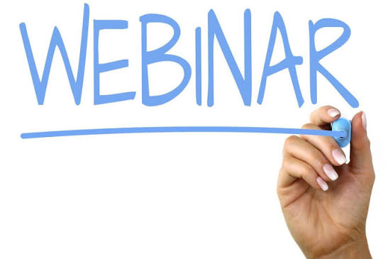 The word "WEBINAR" handwritten in blue marker, underlined, by a hand holding the marker.